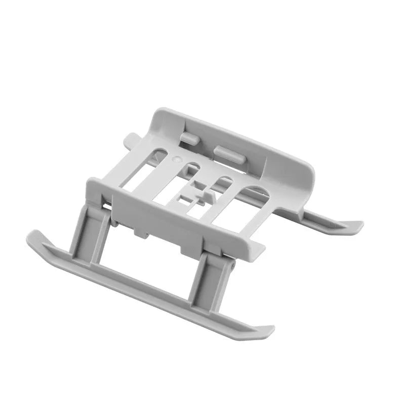 Grey plastic folding UAV landing gear monopod tripod unfolded on a table
