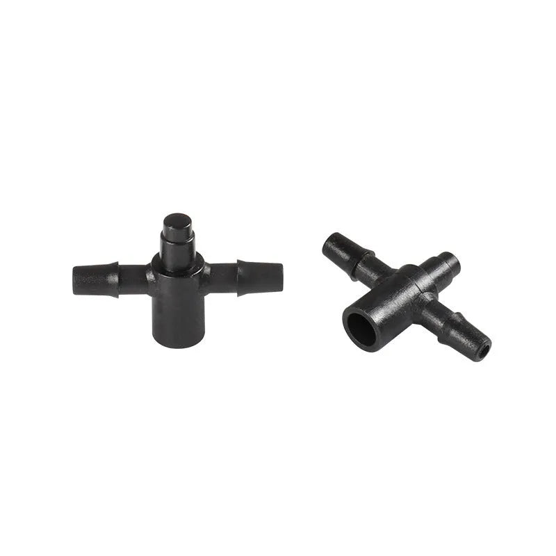 White PE plastic tee water distributor joint for micro spray irrigation system.