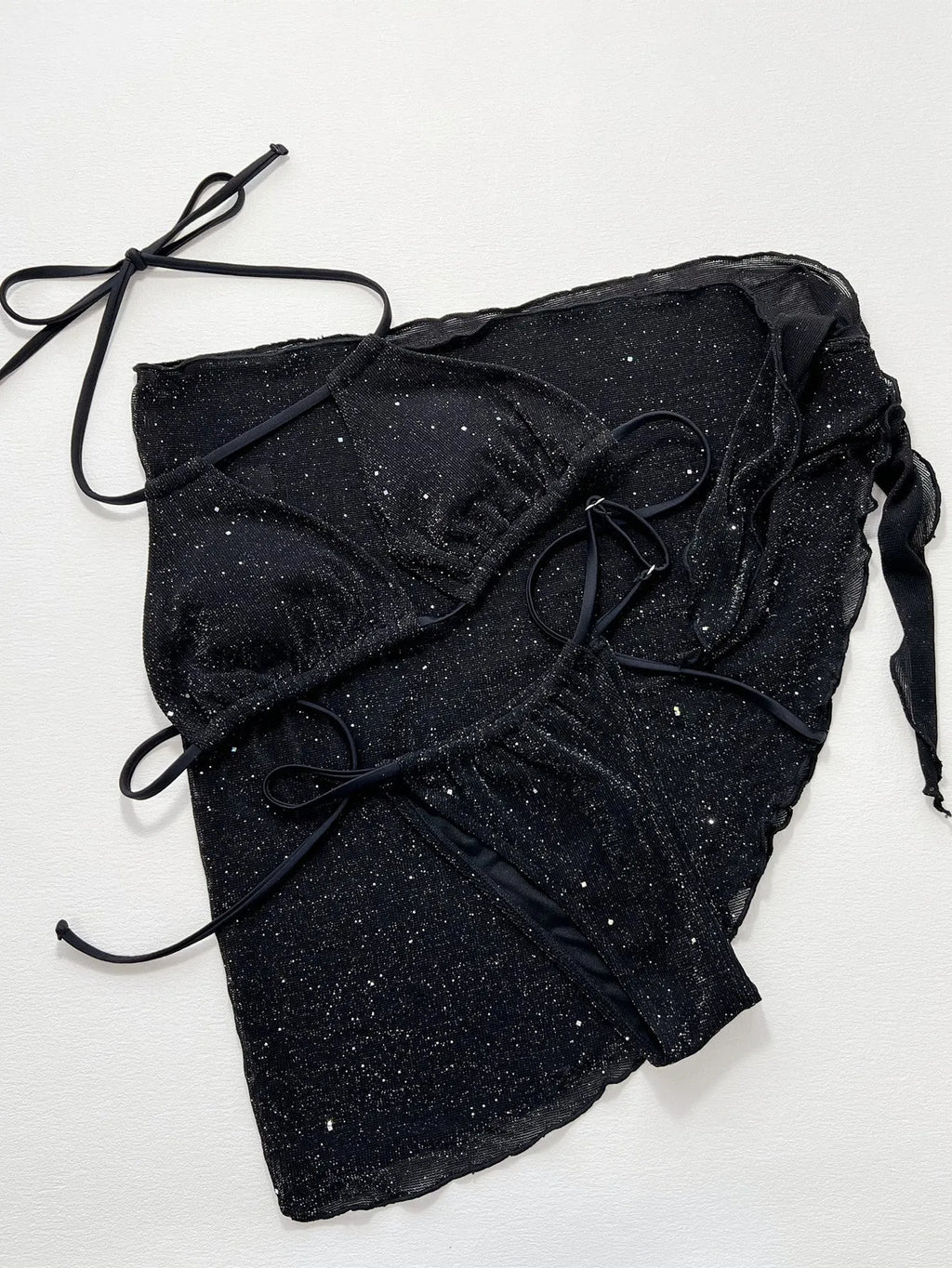 Black three-piece bikini swimsuit set with top and shorts on mannequin