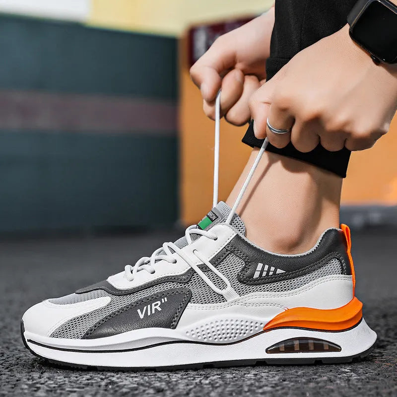 Men's grey and black mesh running shoes with EVA sole and sewing thread detail on a white background.