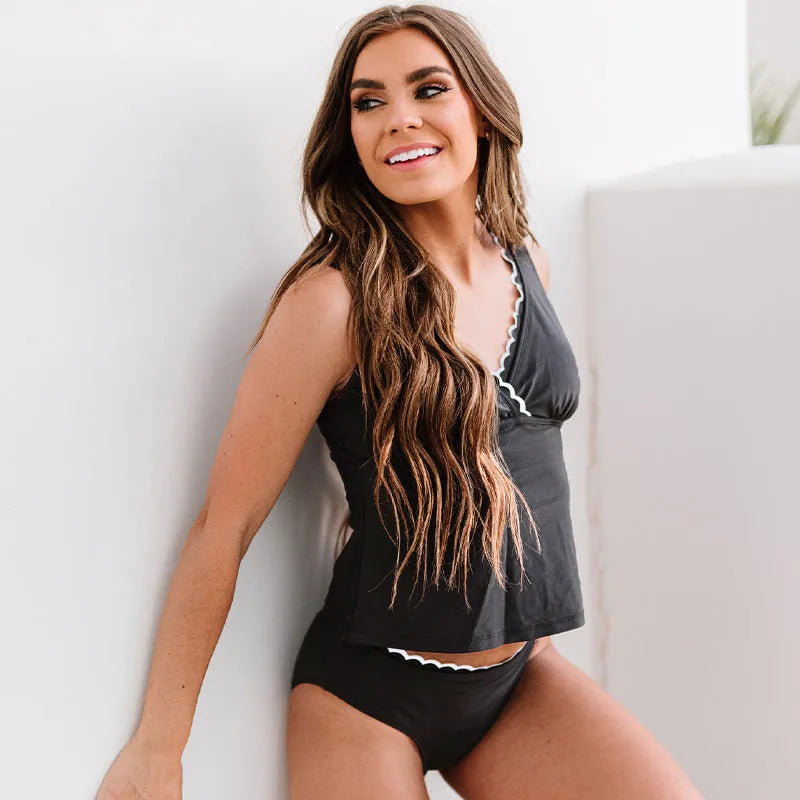 Black women's one-piece split swimsuit in nylon fabric with sleeveless design