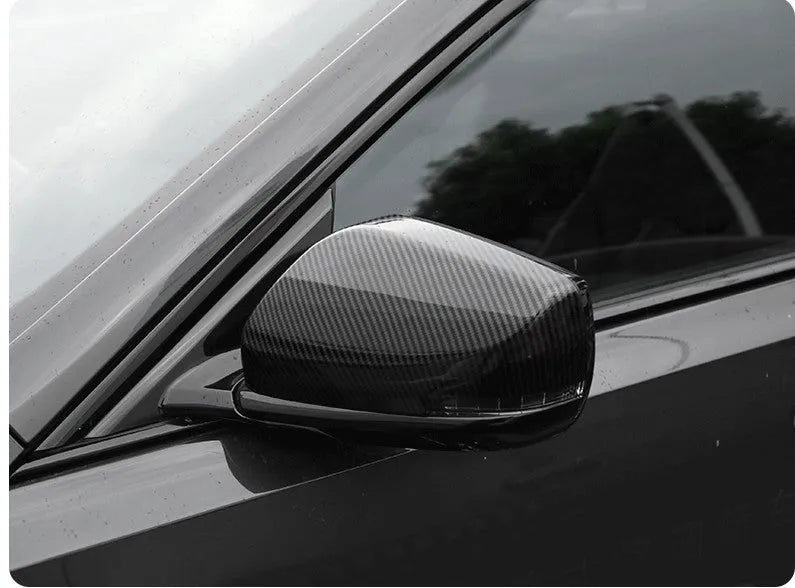 Pair of black ABS rearview mirror covers with carbon fibre pattern for Cadillac CT5 CT6.