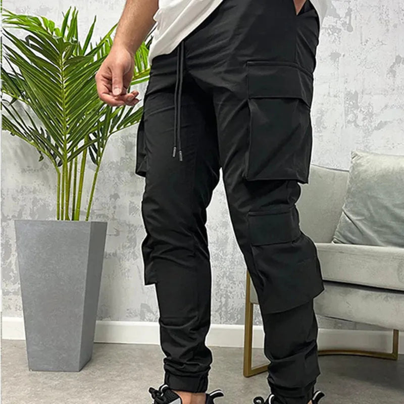 Men's stretch breathable nylon ankle banded sports slacks in black, for fitness and leisure