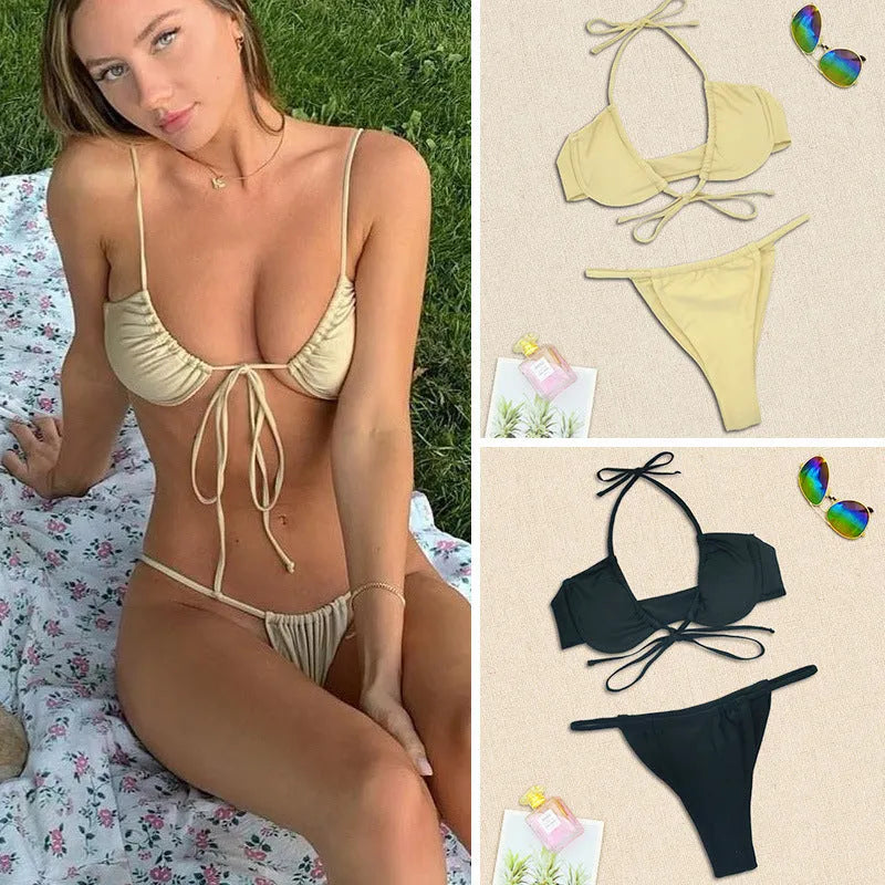 Women's black and mint green two-piece nylon bikini swimsuit on a mannequin.