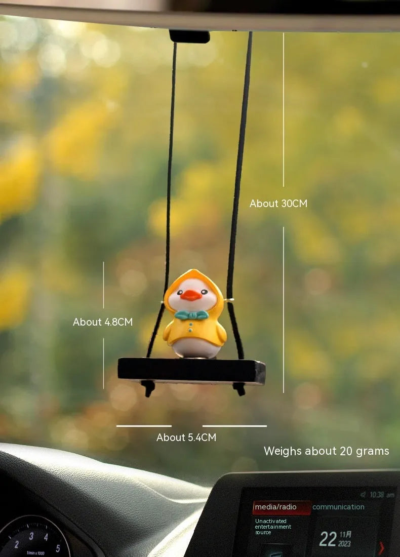 Cute yellow plastic duck doll car hanging ornament in a cartoon style.