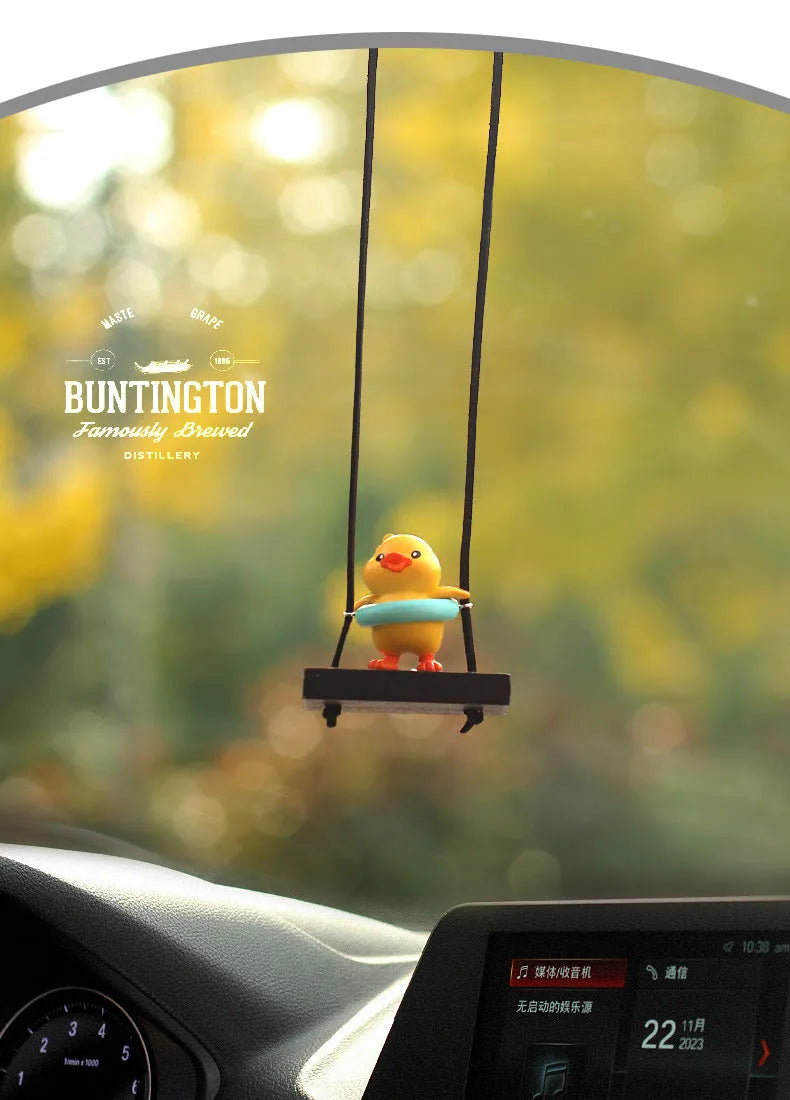 Cute yellow plastic duck doll car hanging ornament in a cartoon style.