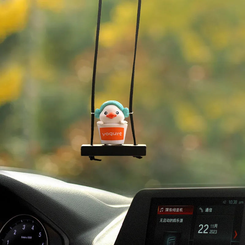 Cute yellow plastic duck doll car hanging ornament in a cartoon style.