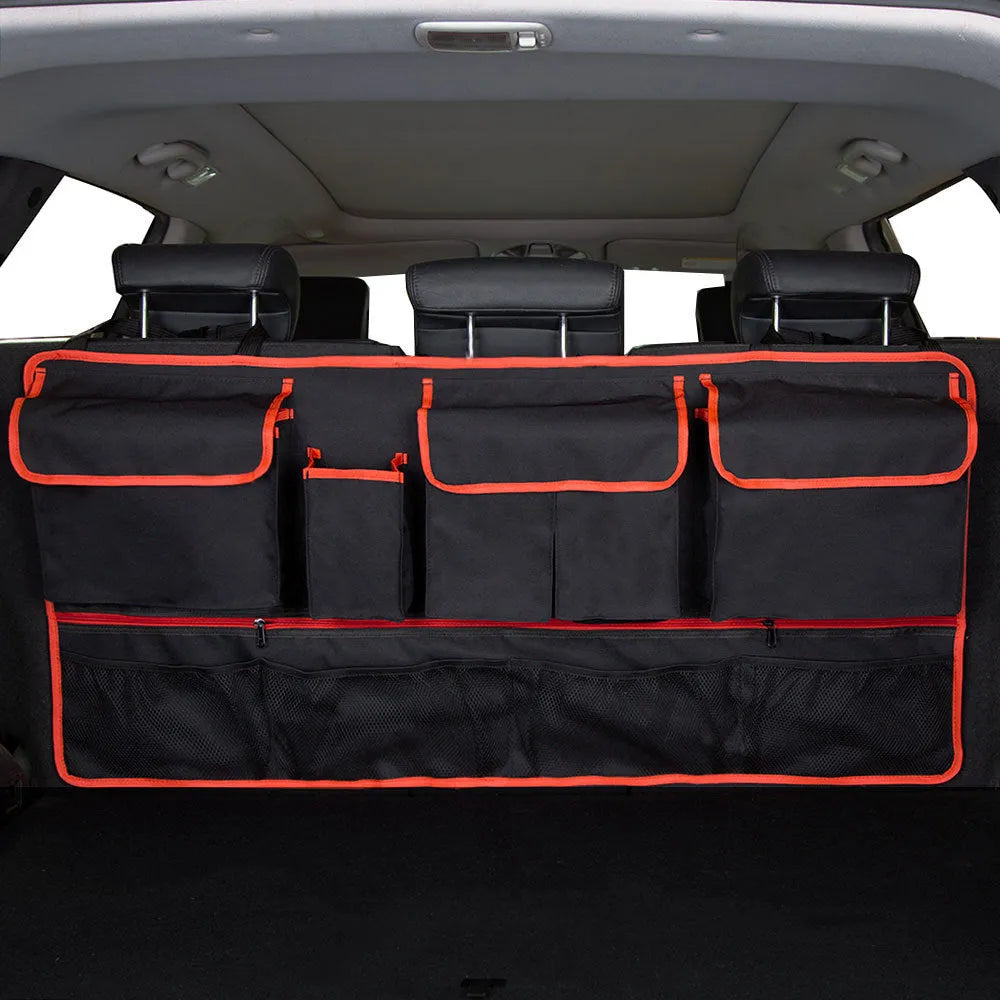 Car boot hanging storage bag made from black Oxford cloth with red piping and handle