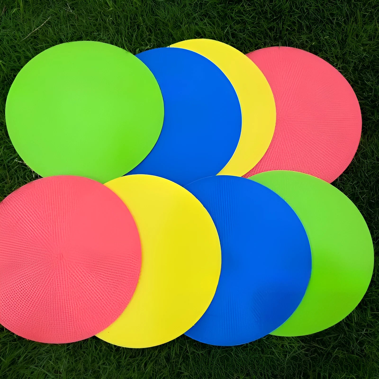 Flat circular TPE football training marker disc in bright colours for field practice.