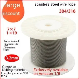 Close-up of a multi-strand 304 stainless steel anti-theft security cable coiled on a dark surface.