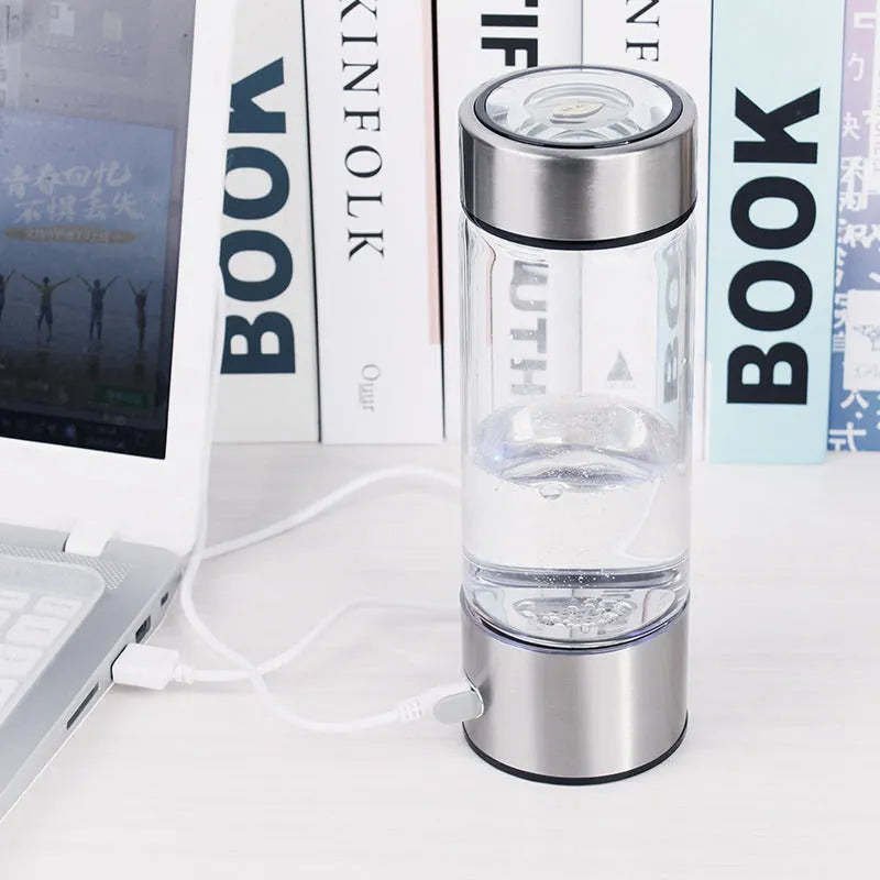 Silver hydrogen water bottle with borosilicate glass construction and electric hydrogen generator