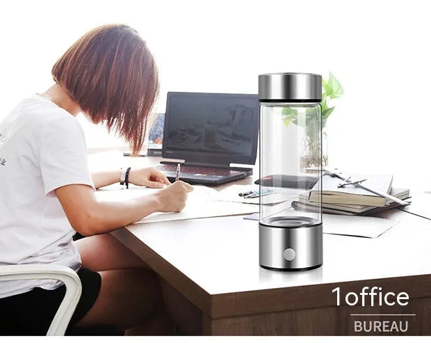 Silver hydrogen water bottle with borosilicate glass construction and electric hydrogen generator