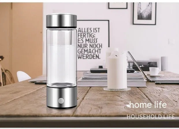 Silver hydrogen water bottle with borosilicate glass construction and electric hydrogen generator
