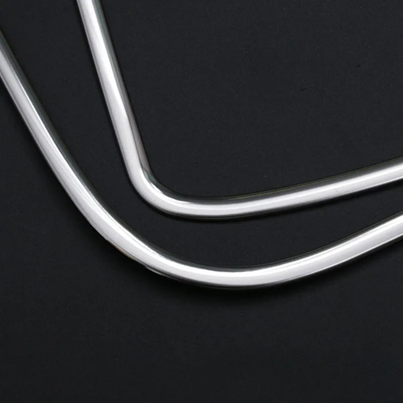 Two silver stainless steel door audio frame trim pieces for ROOX40 series vehicles