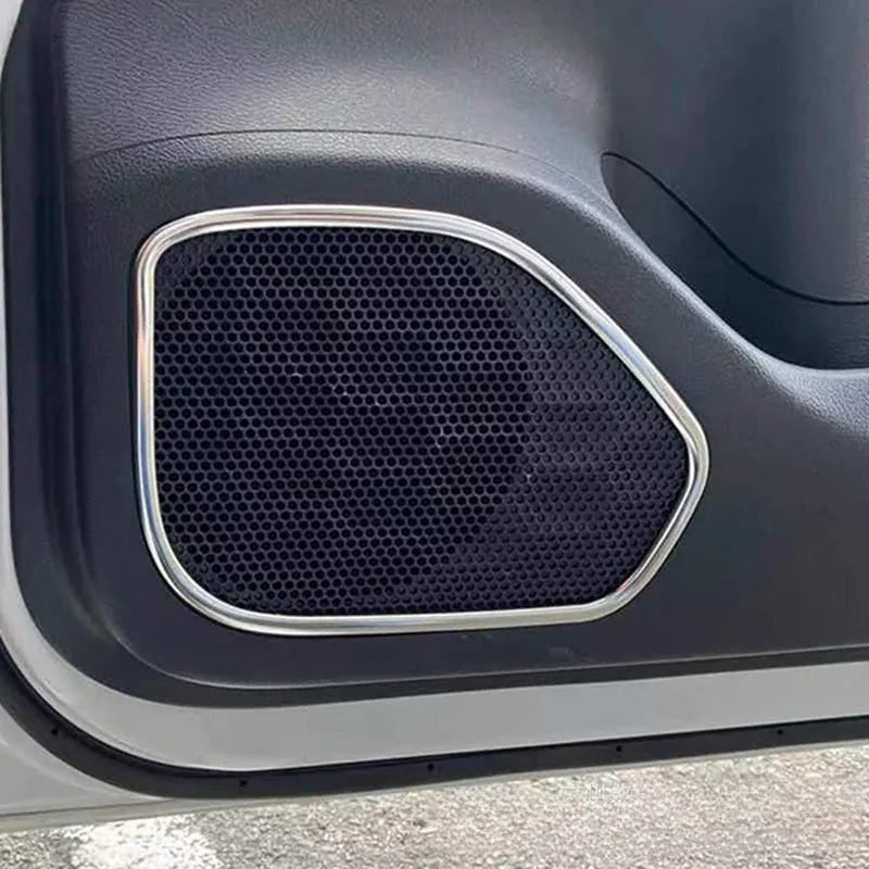 Two silver stainless steel door audio frame trim pieces for ROOX40 series vehicles