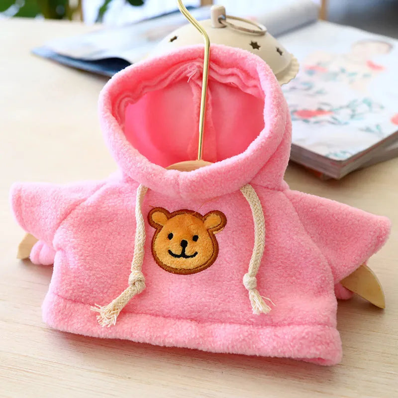 A dog wearing a soft cloth zip-up hoodie sweater in a choice of colours including a grey bear print.