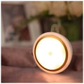 Compact circular white motion sensor LED light with 80mm diameter for automatic wardrobe or corridor lighting.