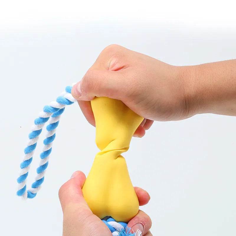 Green porous bone dog toy with knotted rope ends and food cavity for cheese or beef strips