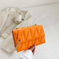 Small square crossbody shoulder bag in PU leather with chain and shoulder strap, available in five colours, 22cm width