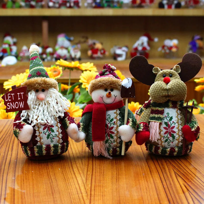 Red, green, and white flannel Christmas decorations including snowman, Santa, and elk designs