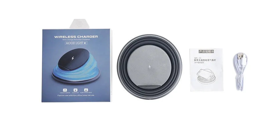 Grey wireless charger pad with silicone surface on a desk, 138mm square shape