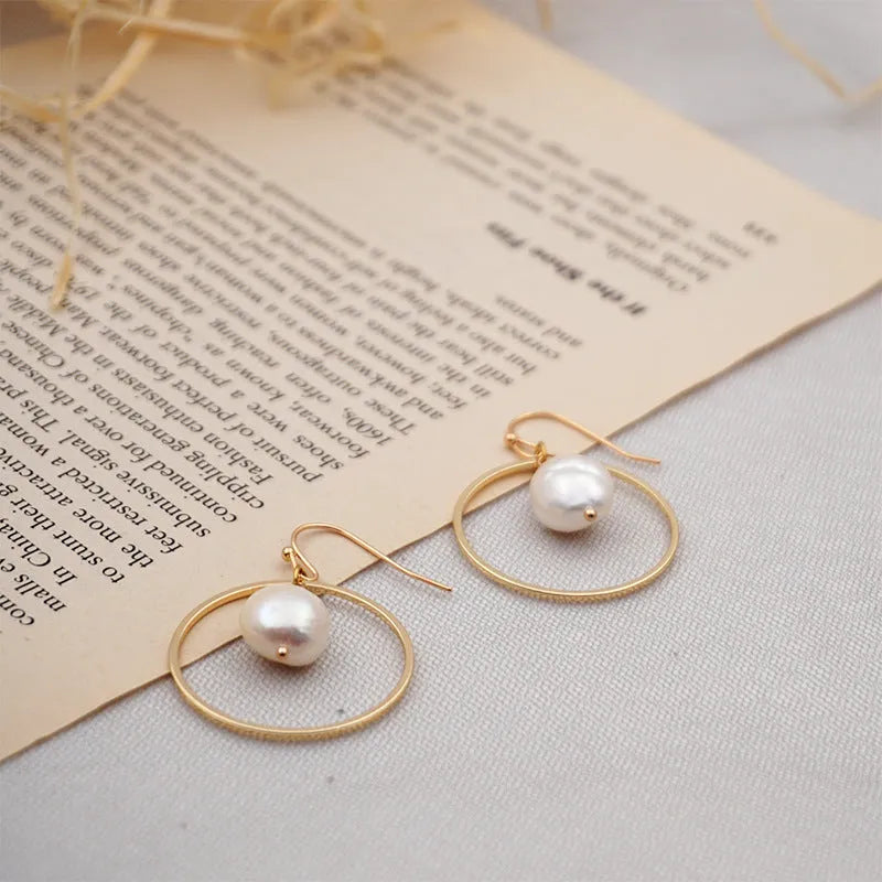 Baroque large circle shaped pearl earrings in simple geometric style for women