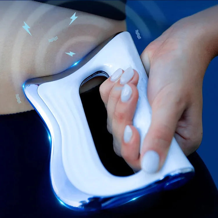 Rectangular natural resin muscle massager and scraping board on a flat surface.