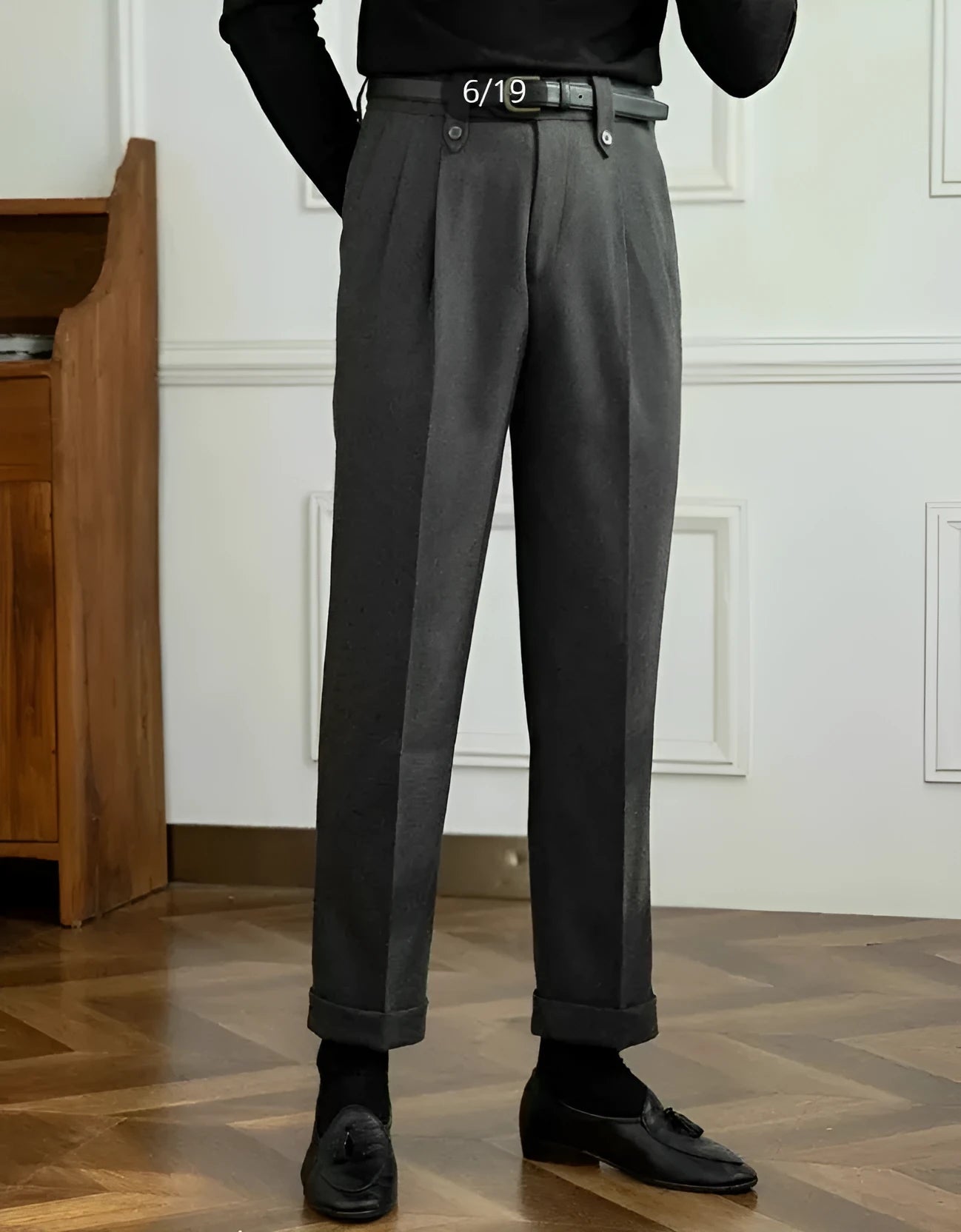 Grey high-waist straight-leg casual trousers on a hanger, showing button and zip detail.