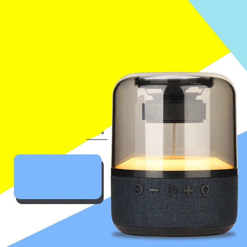 Four-colour light touch Bluetooth speaker with halo effect display showing wireless portable design