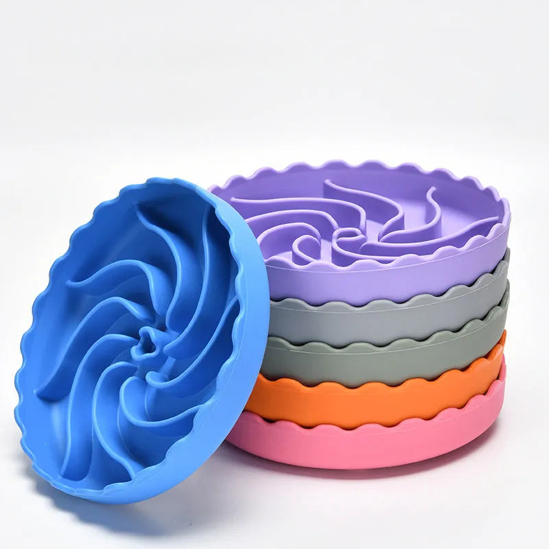Food-grade silicone slow feeder dog bowl in blue with suction cup base and raised maze ridges