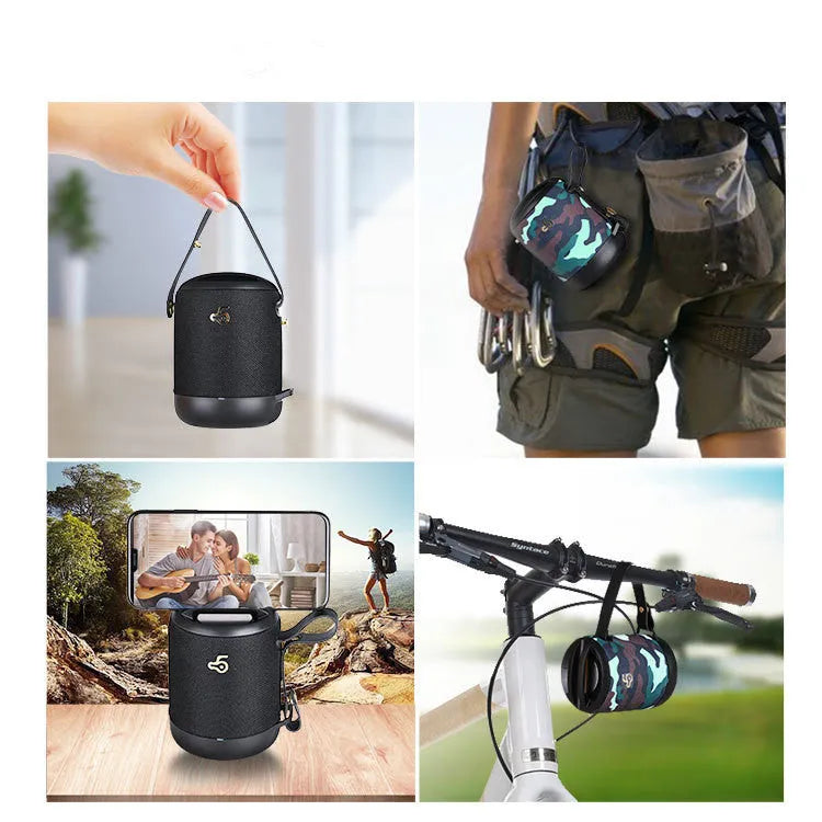 Compact black wireless Bluetooth speaker with carry strap showing its portable size