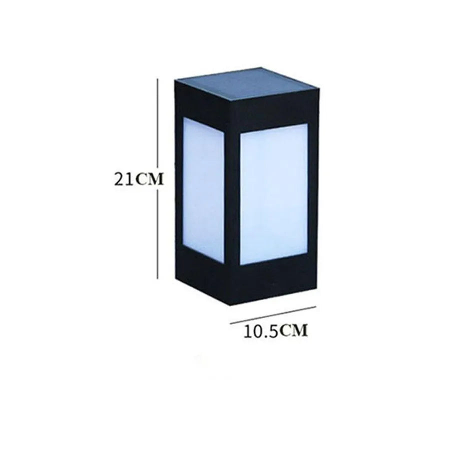 Set of solar-powered garden lights with LED illumination staked along a garden path at dusk