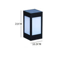 Set of solar-powered garden lights with LED illumination staked along a garden path at dusk