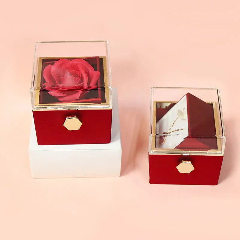 Rotating drawer jewellery gift box with preserved red rose under clear acrylic dome.