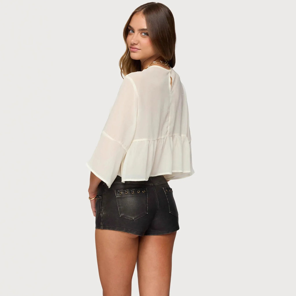 Creamy white chiffon T-shirt with batwing sleeves showing short length and pullover design