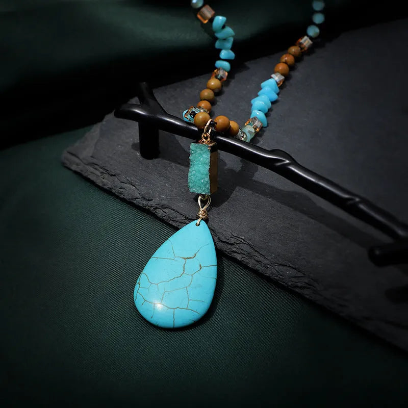 Blue turquoise heart and water drop shape pendant necklace with mixed gem inlay on a ball bead chain.
