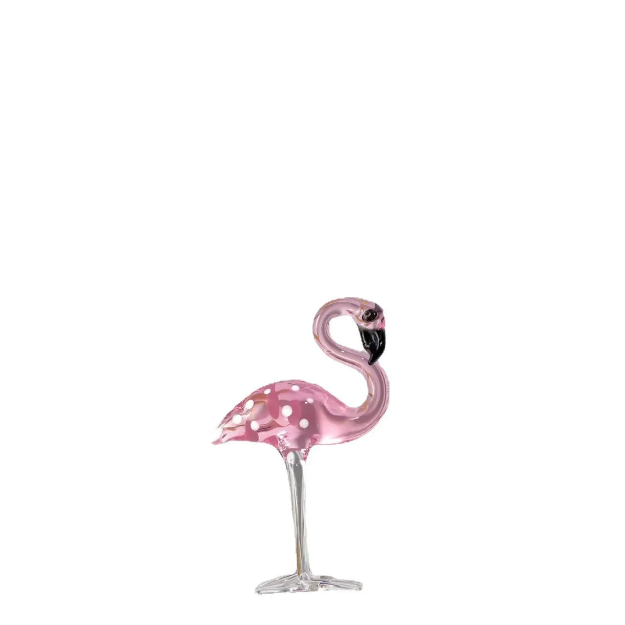 Pink crystal flamingo decorative figure on a table in modern style.
