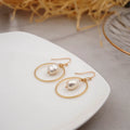 Baroque large circle shaped pearl earrings in simple geometric style for women