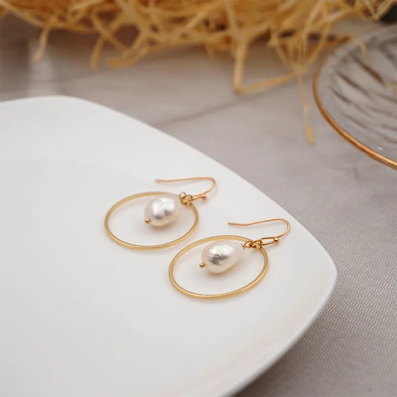 Baroque large circle shaped pearl earrings in simple geometric style for women