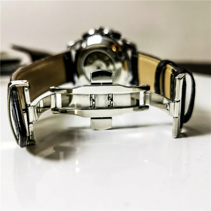Men's automatic mechanical watch with a 12mm case in silver, black, and gold colour options on a wrist.