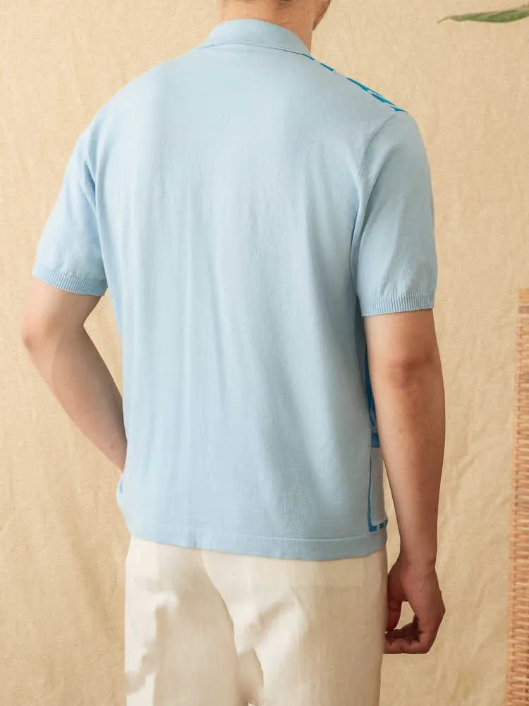 A royal blue striped short-sleeved polo cardigan with a lapel collar, laid flat.