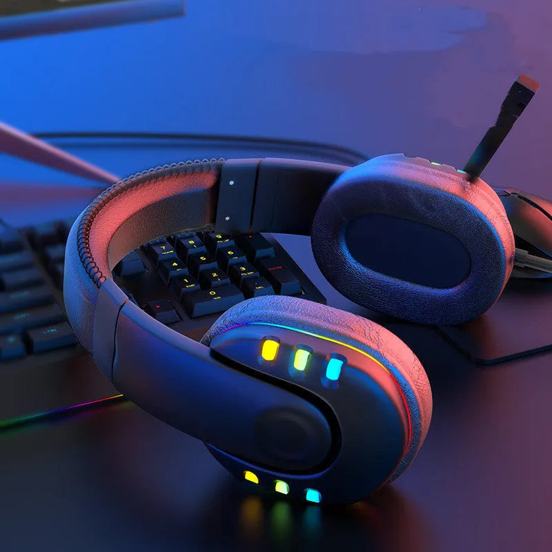 Black Colourful gaming headset with LED breathing light, sponge ear cushions, nylon cable, and omnidirectional microphone on a desk