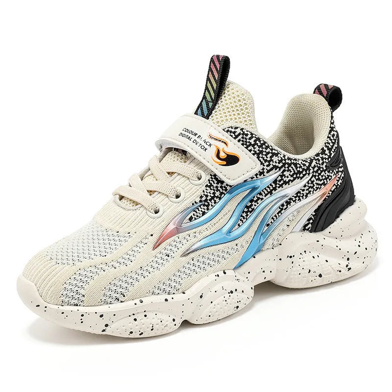 Boys beige mesh sneakers with black trim and anti-slip rubber sole on a white background.
