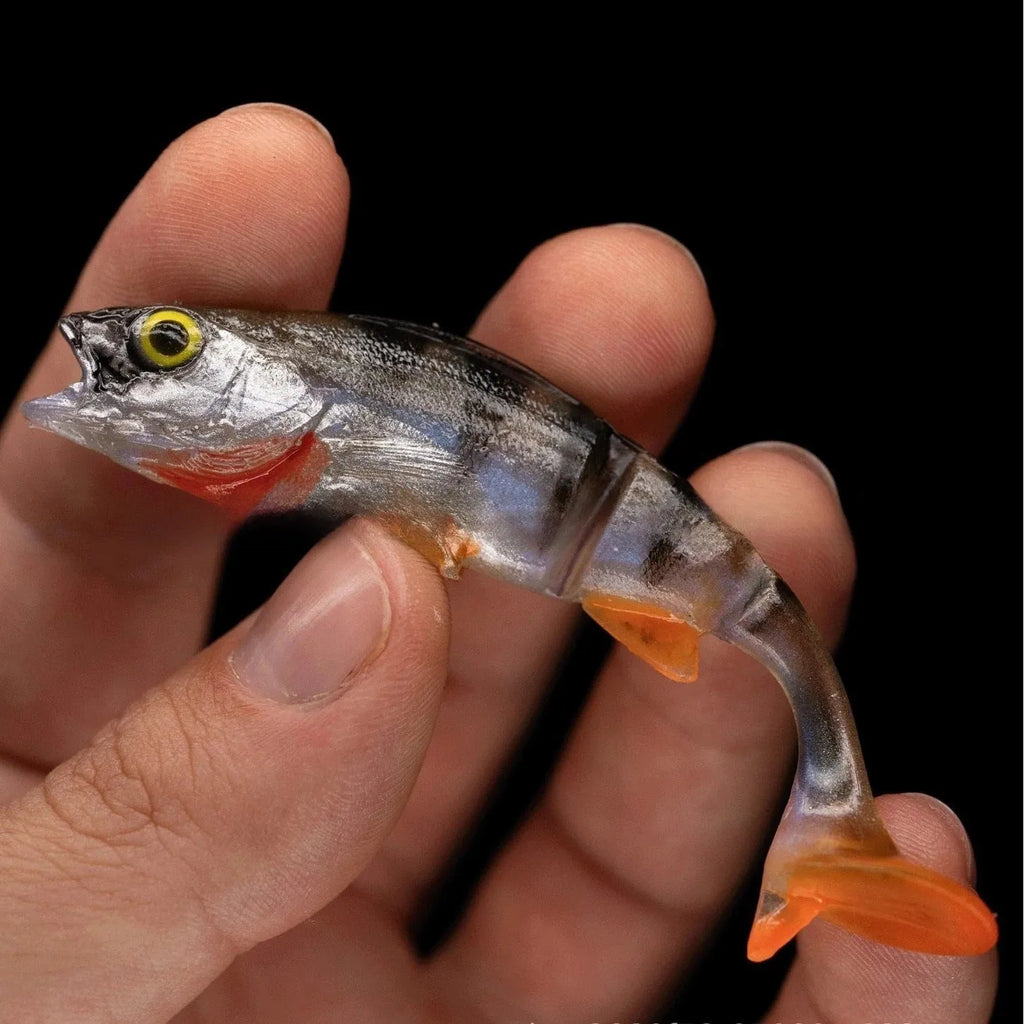 Soft plastic fishing lure with T-tail design and fish pattern colour