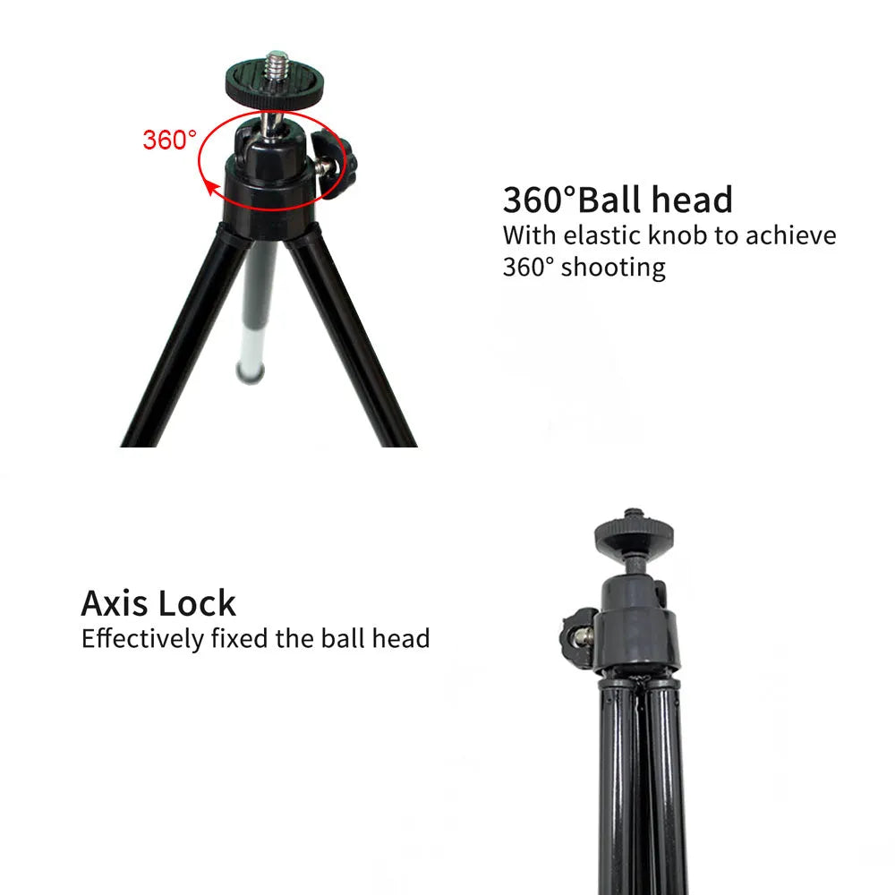 Mini aluminium tripod with extended legs and a black U-shaped phone clip attached