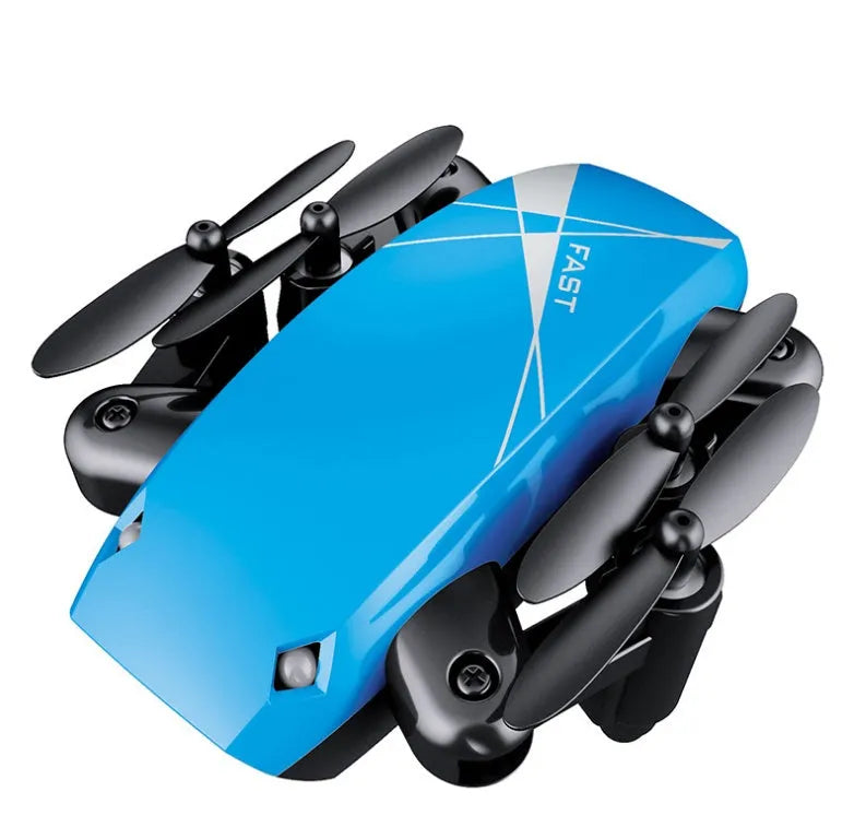 Micro foldable RC drone with 300K WiFi camera in blue, deployed on surface showing foldable arms