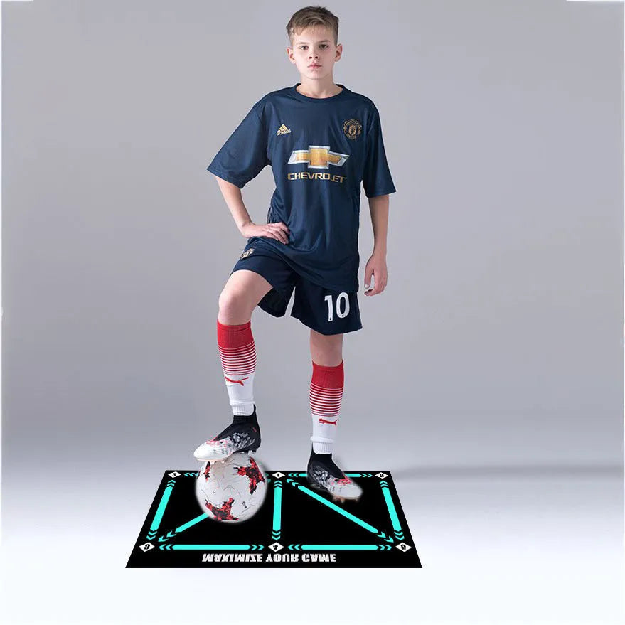Black rectangular non-slip football training mat measuring 60 by 90 centimetres.