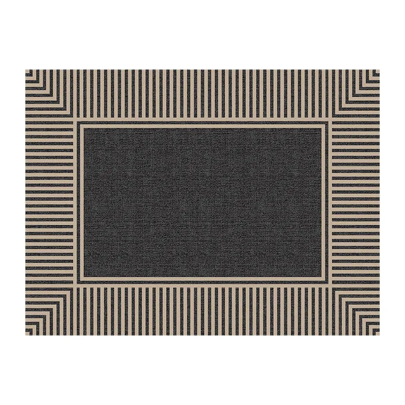 Polyester non-slip entrance door mat with geometric pattern in grey, placed on a tiled floor