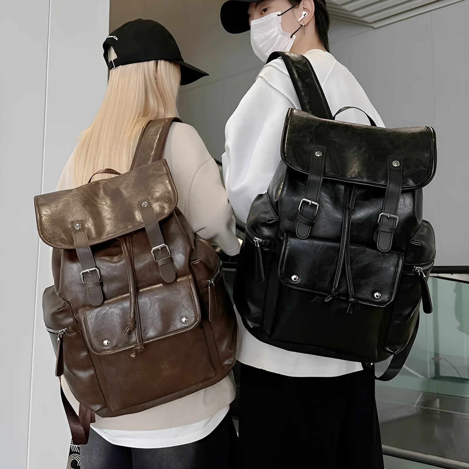 Solid colour PU couple travel backpack in black, curved shoulder strap, waterproof design for leisure travel