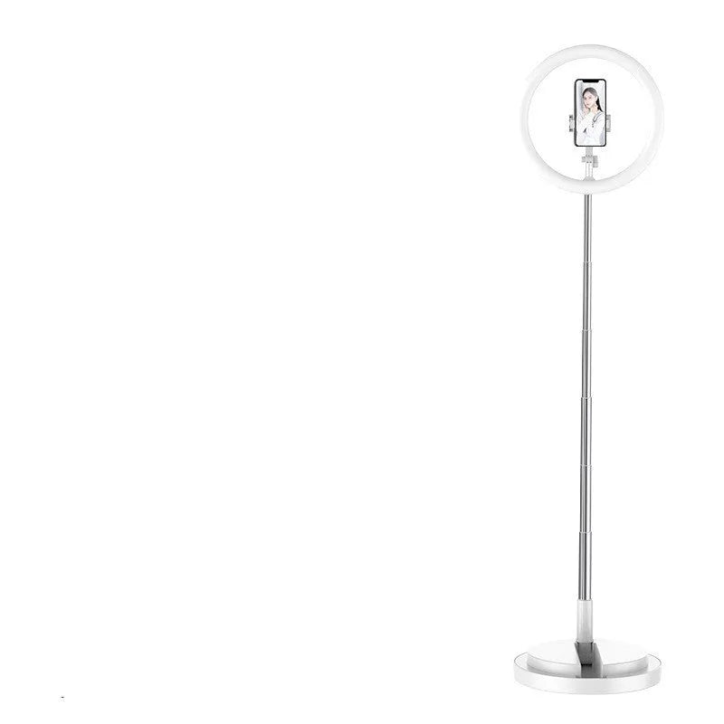 Portable 290mm LED selfie ring light in black on table, showing centre phone holder and adjustable brightness button